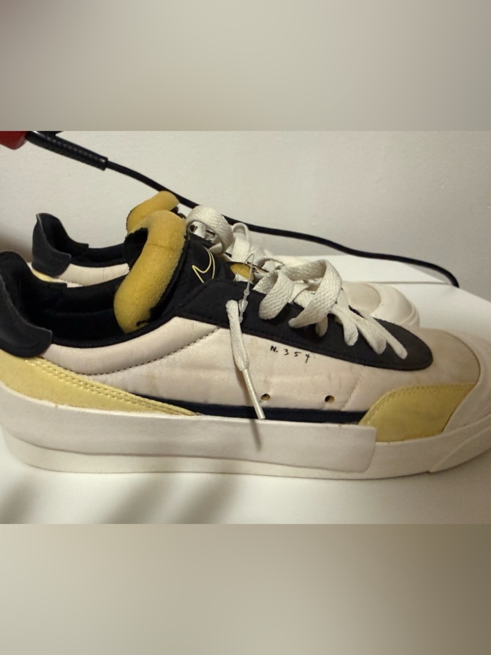 Nike Drop Type LX sneakers, likely the 'Bicycle Yellow' colorway 8.5